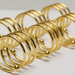 Load image into Gallery viewer, Gold Orb Spiral Napkin Rings