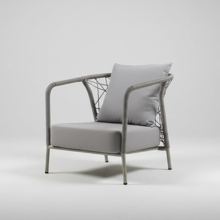 Gray armchair with cushion on a white background