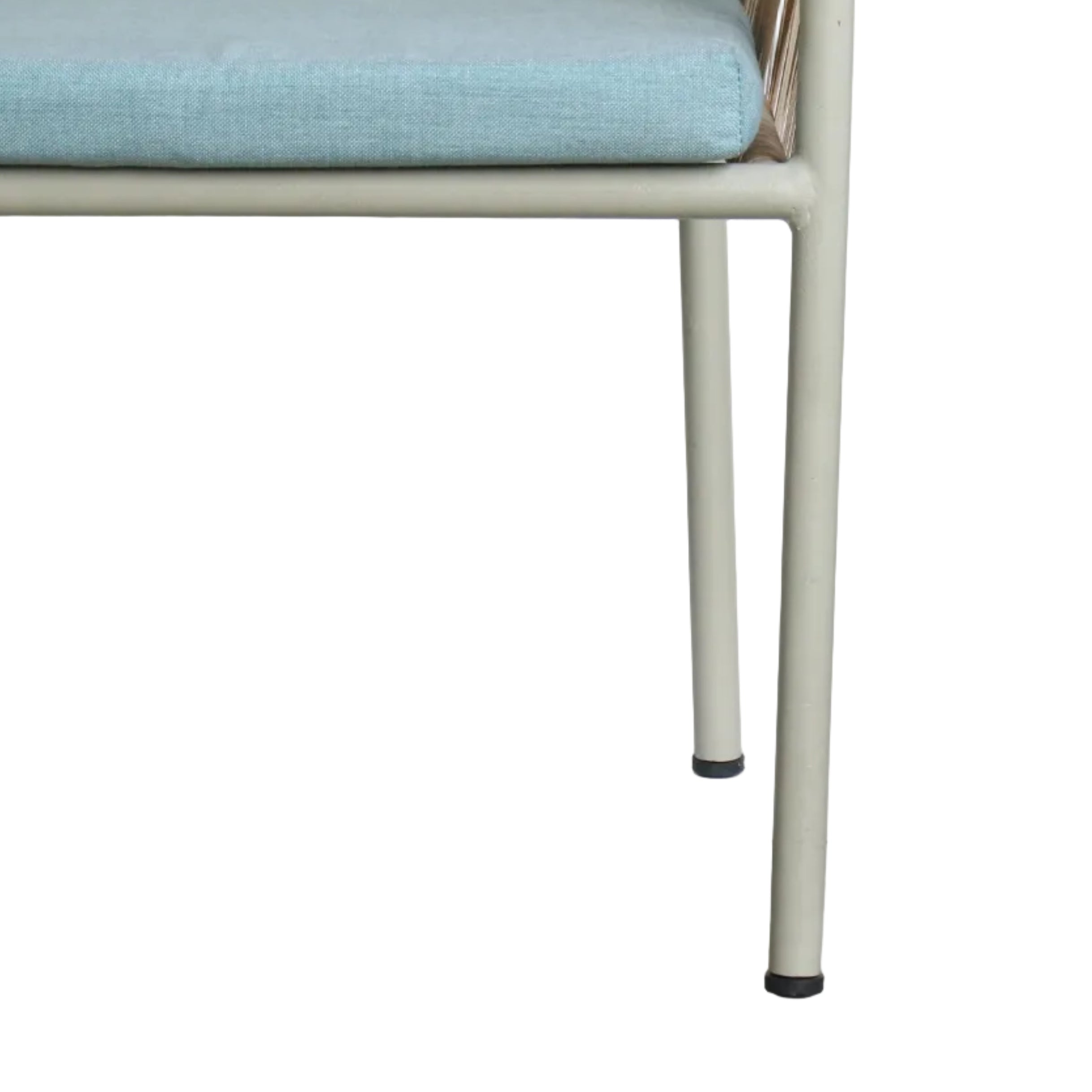 Chair with a light blue cushion on a concrete floor, with a white wall and electrical outlet in the background.
