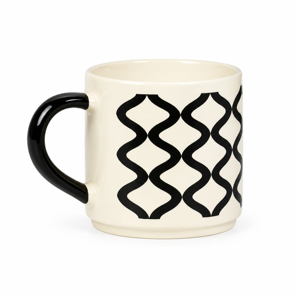 An off-white ceramic mug with a black handle and a black geometric wavy trellis pattern on the side, set against a plain light gray background.
