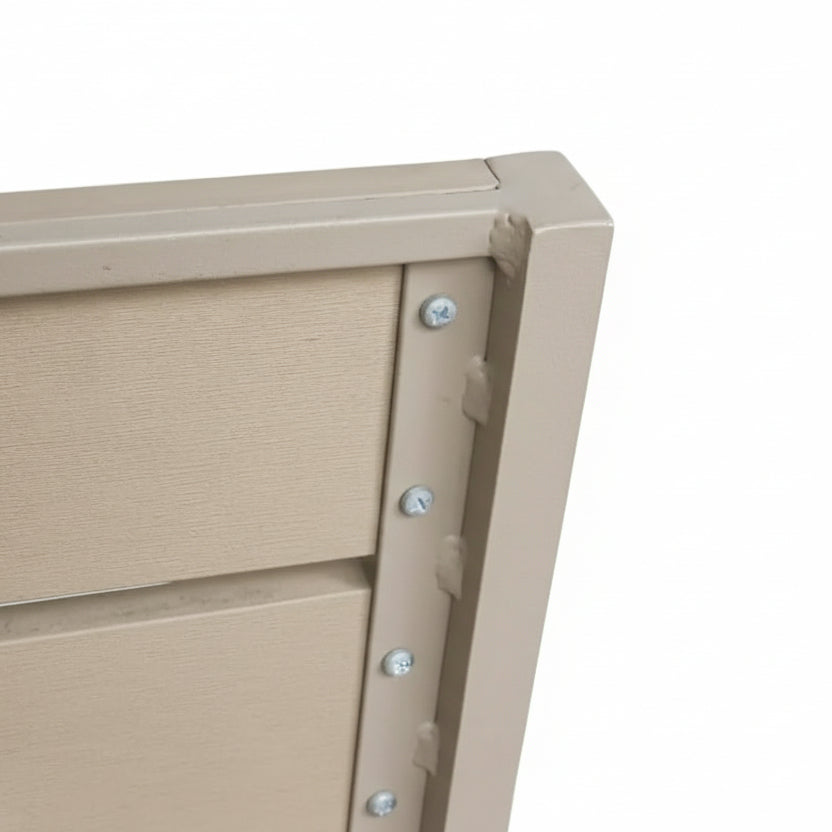 Close-up of a beige metal box with a textured surface and visible screws on a white background