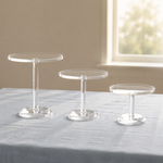 Load image into Gallery viewer, Transparent Cake Stand displayed on a complementary linen tablecloth

